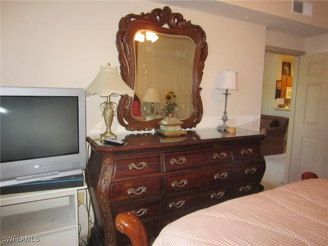 bedroom featuring visible vents