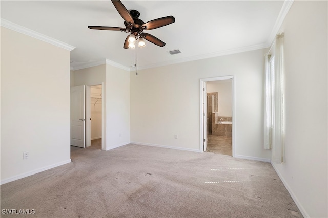 unfurnished bedroom featuring ornamental molding, light colored carpet, visible vents, and baseboards