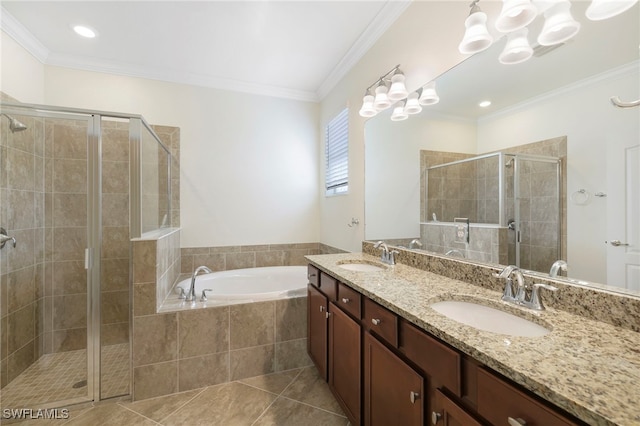 bathroom with crown molding, a sink, and a shower stall