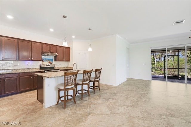 kitchen featuring stainless steel electric stove, visible vents, ornamental molding, light stone countertops, and a kitchen bar