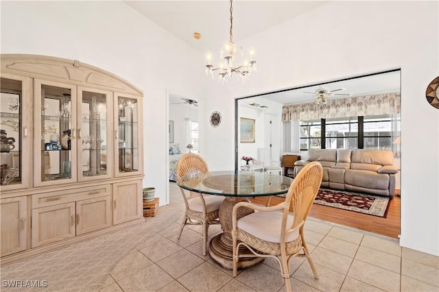 17862 Dracena Cir, North Fort Myers, FL 33917 - dining area featuring light tile patterned floors and a notable chandelier