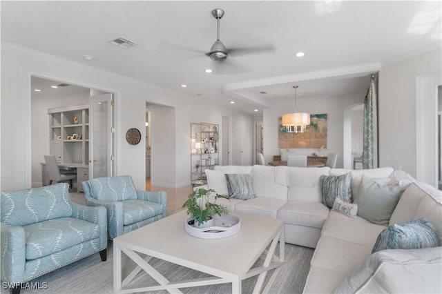 living area with recessed lighting, visible vents, ceiling fan, and ornamental molding