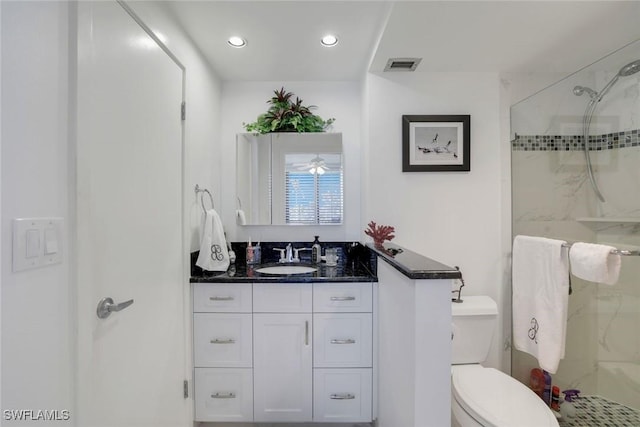 full bath featuring toilet, recessed lighting, vanity, visible vents, and a stall shower