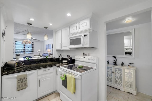 kitchen featuring pendant lighting, white appliances, white cabinetry, and light tile patterned floors