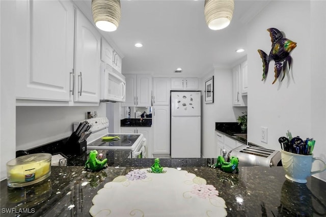 kitchen featuring dark stone counters, recessed lighting, white appliances, and white cabinetry