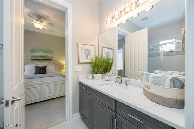 ensuite bathroom with visible vents, a shower stall, vanity, ensuite bath, and a ceiling fan