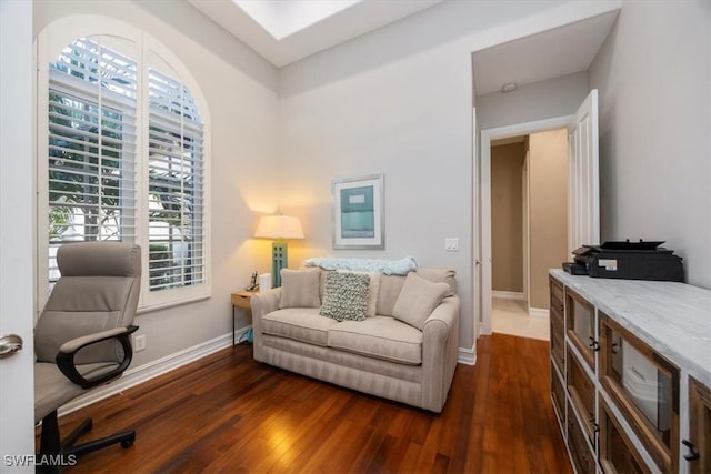 interior space with dark wood-type flooring and baseboards