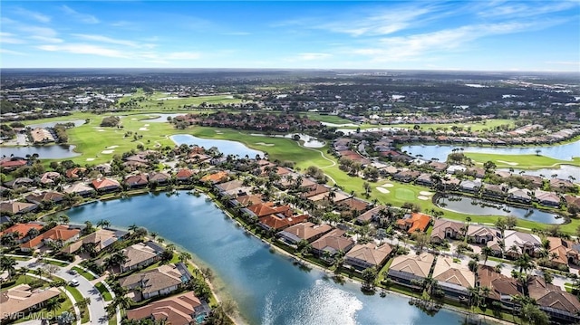 drone / aerial view featuring a residential view, a water view, and view of golf course