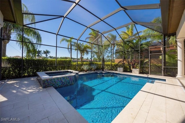 view of pool featuring a lanai, a patio area, and a pool with connected hot tub