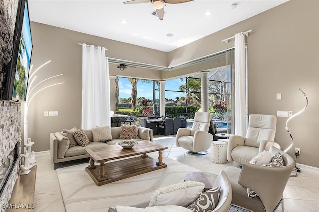 tiled living area with recessed lighting, baseboards, and a ceiling fan