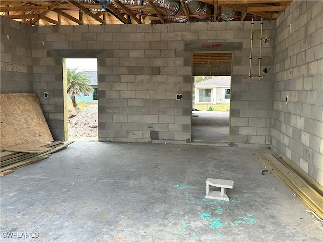 interior space featuring concrete block wall