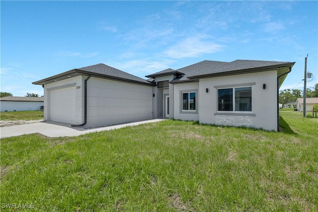 13224 Foresman Blvd, Port Charlotte, FL 33981 - prairie-style home with driveway, a front lawn, an attached garage, and stucco siding