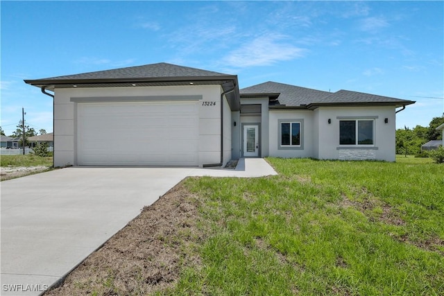 13224 Foresman Blvd, Port Charlotte, FL 33981 - prairie-style house featuring concrete driveway, a garage, stucco siding, and a front lawn