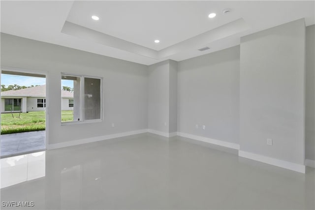 13224 Foresman Blvd, Port Charlotte, FL 33981 - tiled spare room with a raised ceiling and recessed lighting