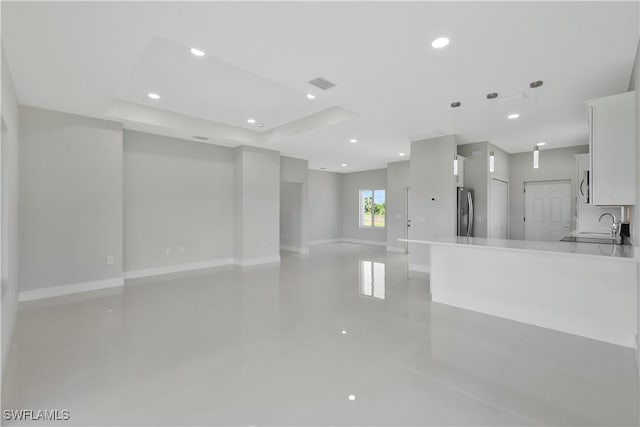 13224 Foresman Blvd, Port Charlotte, FL 33981 - unfurnished living room featuring recessed lighting and a raised ceiling