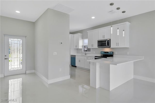 13224 Foresman Blvd, Port Charlotte, FL 33981 - kitchen featuring stainless steel microwave, range with electric cooktop, light countertops, dishwasher, and white cabinets