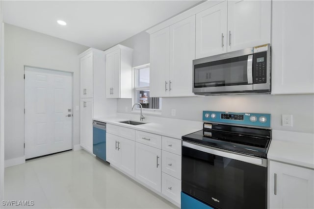 13224 Foresman Blvd, Port Charlotte, FL 33981 - kitchen featuring stainless steel appliances, light countertops, white cabinets, and recessed lighting