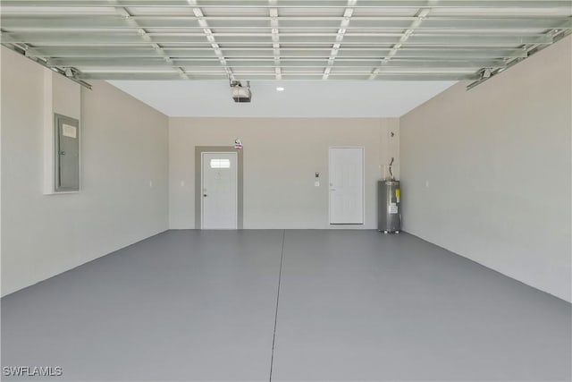 13224 Foresman Blvd, Port Charlotte, FL 33981 - garage featuring electric water heater, electric panel, and a garage door opener