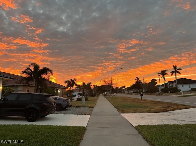 view of street with street lighting, a residential view, and sidewalks