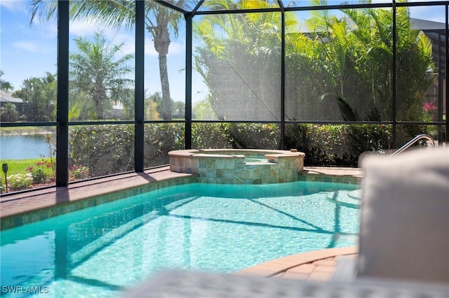 outdoor pool featuring a water view and an in ground hot tub