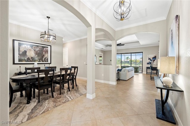 dining space with light tile patterned floors, baseboards, ornamental molding, and a notable chandelier