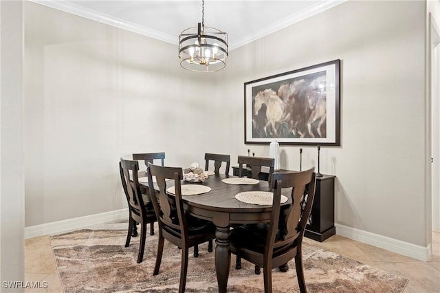 tiled dining area featuring an inviting chandelier, baseboards, and crown molding