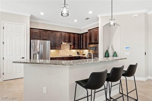 kitchen with light stone counters, crown molding, light tile patterned floors, stainless steel appliances, and under cabinet range hood