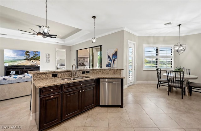 kitchen featuring dishwasher, crown molding, open floor plan, and a sink