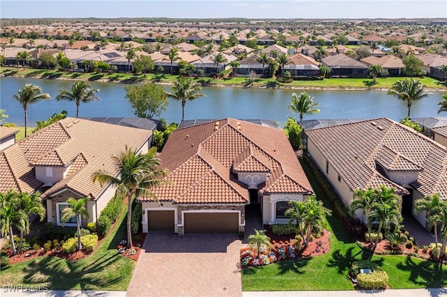 bird's eye view with a water view and a residential view