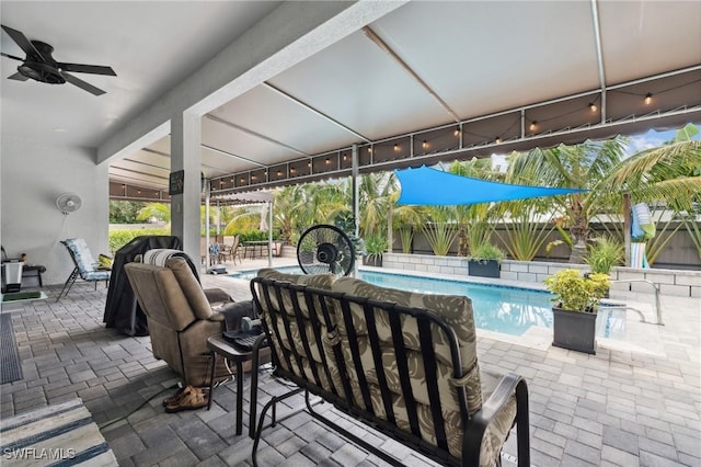 view of patio featuring fence, a ceiling fan, and a fenced in pool