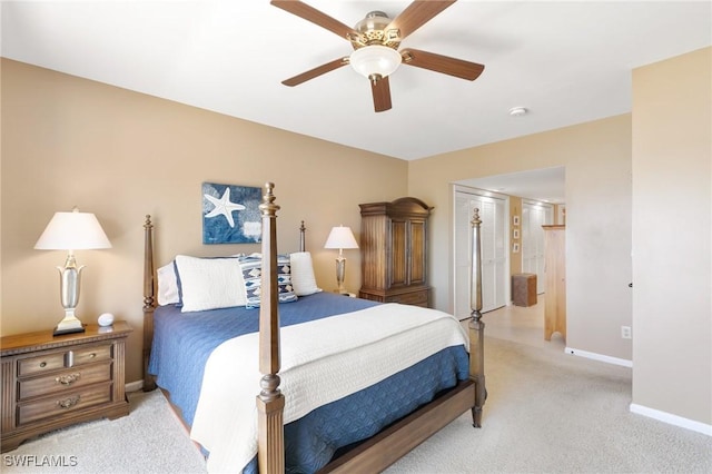 bedroom with light colored carpet, baseboards, and ceiling fan