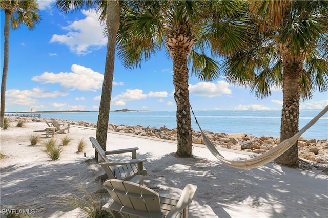 property view of water featuring a beach view