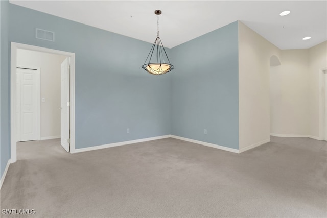 empty room featuring visible vents, recessed lighting, baseboards, and carpet floors