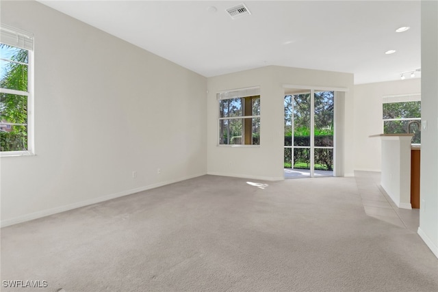 unfurnished room with recessed lighting, baseboards, visible vents, and light carpet