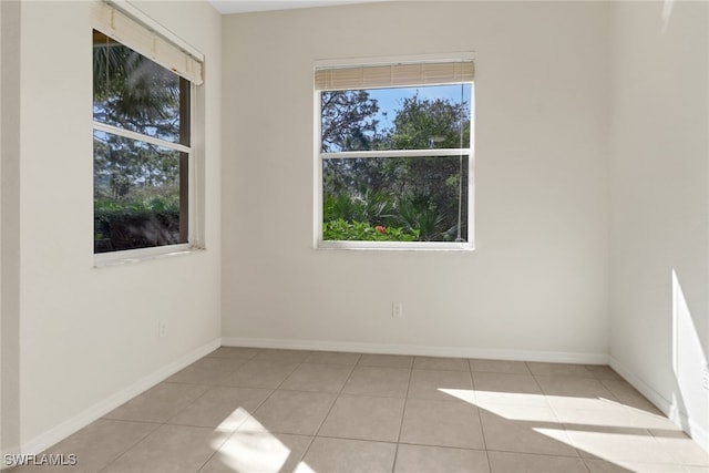 tiled empty room with baseboards