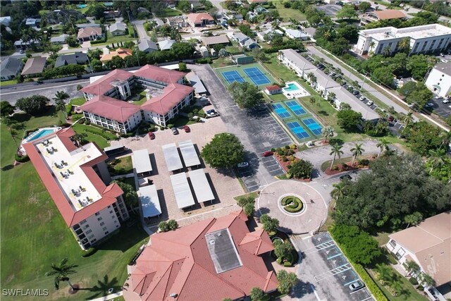 view of sport court featuring a residential view and fence