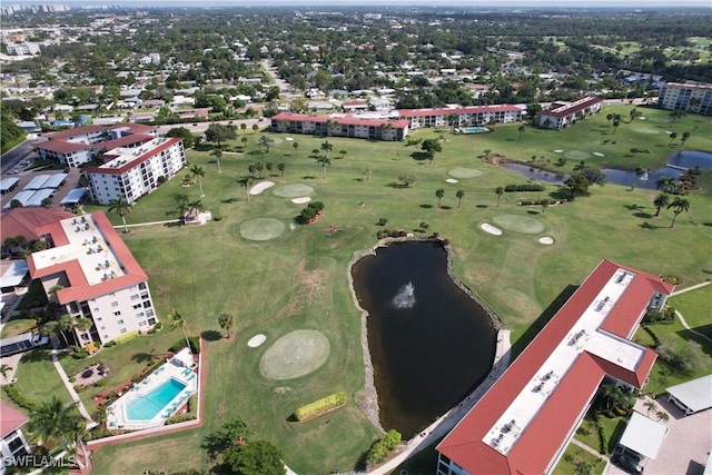 drone / aerial view with view of golf course and a water view