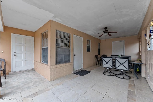 view of patio featuring a ceiling fan and outdoor dining space