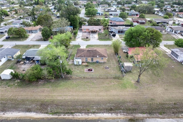 birds eye view of property with a residential view