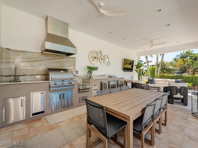 view of patio / terrace featuring grilling area, ceiling fan, outdoor dining space, an outdoor kitchen, and a sink