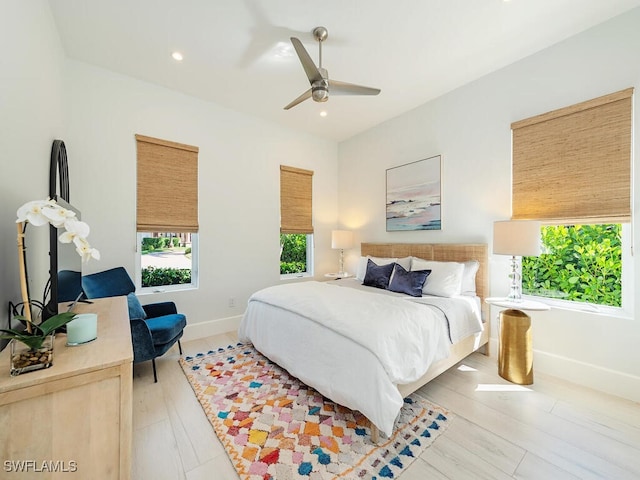 bedroom with ceiling fan, recessed lighting, baseboards, and light wood-type flooring