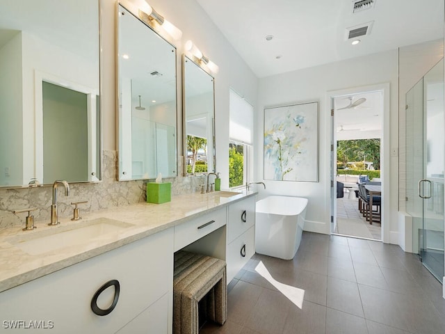 full bathroom featuring a stall shower, visible vents, backsplash, and a sink