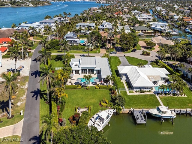 bird's eye view featuring a residential view and a water view