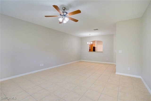 17545 Cherry Ridge Ln, Fort Myers, FL 33967 - unfurnished room featuring arched walkways, light tile patterned floors, visible vents, baseboards, and ceiling fan with notable chandelier