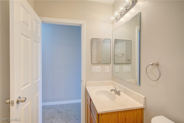 17545 Cherry Ridge Ln, Fort Myers, FL 33967 - bathroom with toilet, vanity, and baseboards