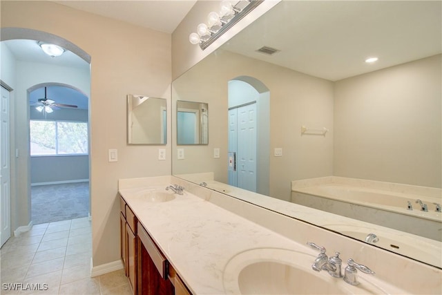 17545 Cherry Ridge Ln, Fort Myers, FL 33967 - bathroom with double vanity, a sink, a bath, and tile patterned floors