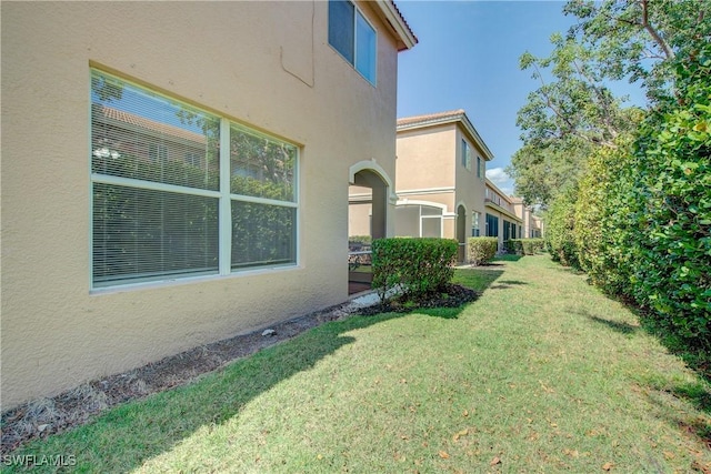 17545 Cherry Ridge Ln, Fort Myers, FL 33967 - exterior space featuring a yard and stucco siding
