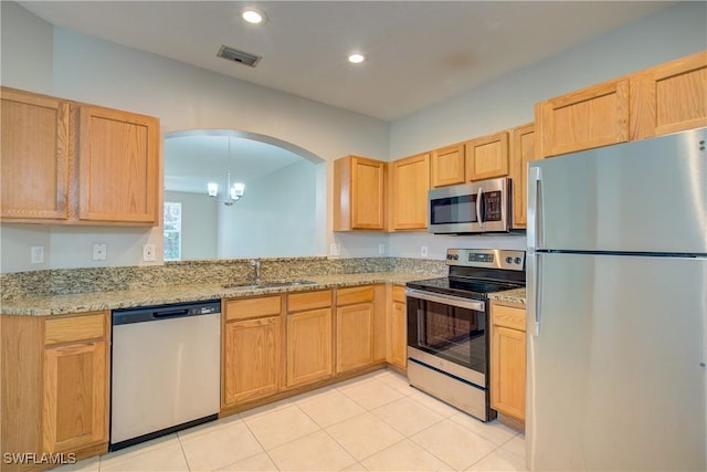 17545 Cherry Ridge Ln, Fort Myers, FL 33967 - kitchen with light tile patterned floors, stainless steel appliances, recessed lighting, visible vents, and a sink