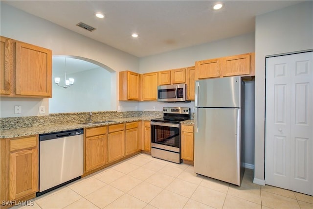 17545 Cherry Ridge Ln, Fort Myers, FL 33967 - kitchen with recessed lighting, visible vents, appliances with stainless steel finishes, a sink, and light stone countertops