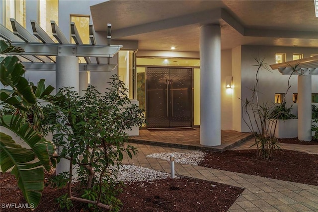 doorway to property with stucco siding
